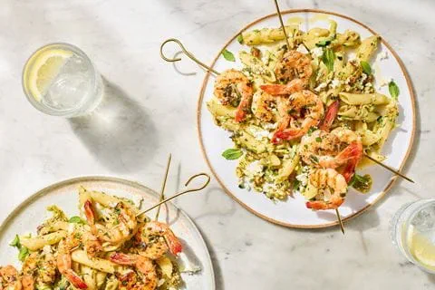 recipe image Herby prawn skewers with courgette, feta & mint pesto pasta salad